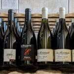 Bouteilles du domaine de La Bouvaude alignée les unes à côté des autres avec leurs étiquettes visibles